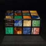 SCATOLA IN PIETRE DURE POLICROME INCASTONATE SU SUPPORTO IN ONICE